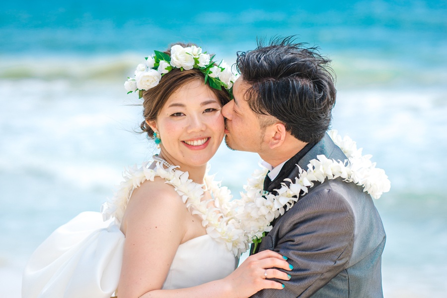 White orchid wedding leis for wedding at Sherwood Forest Beach