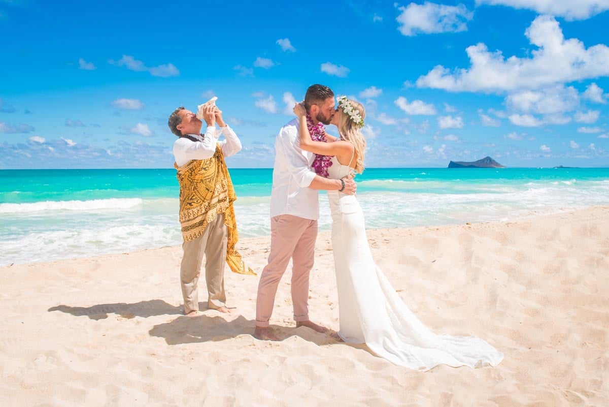 Hawaii beach wedding couple and officiant and Sherwood Forest Beach