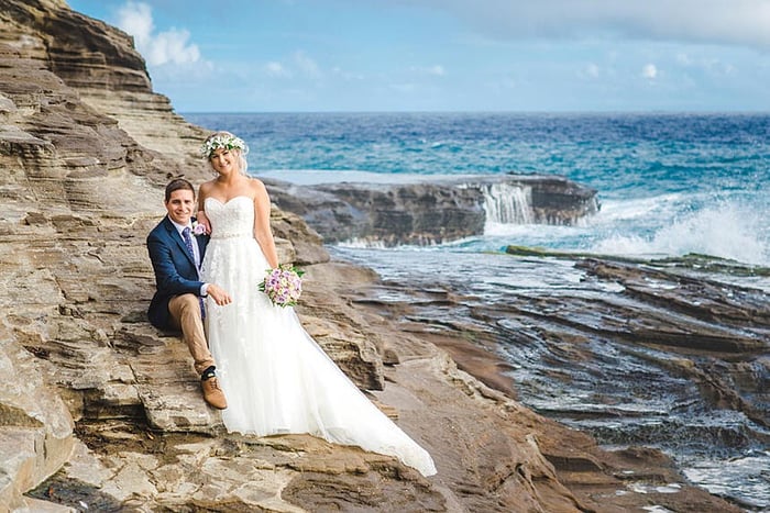 A bride with a long wedding dress train in Hawaii