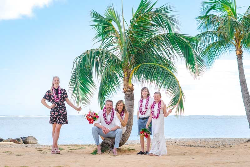 A couple eloping on a beach in Hawaii