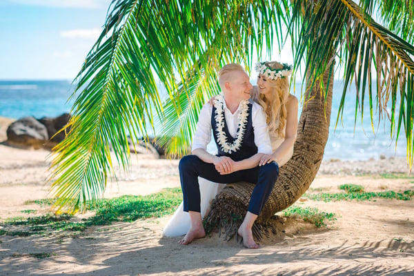 Wedding couple posing at Waialae Beach, Oahu