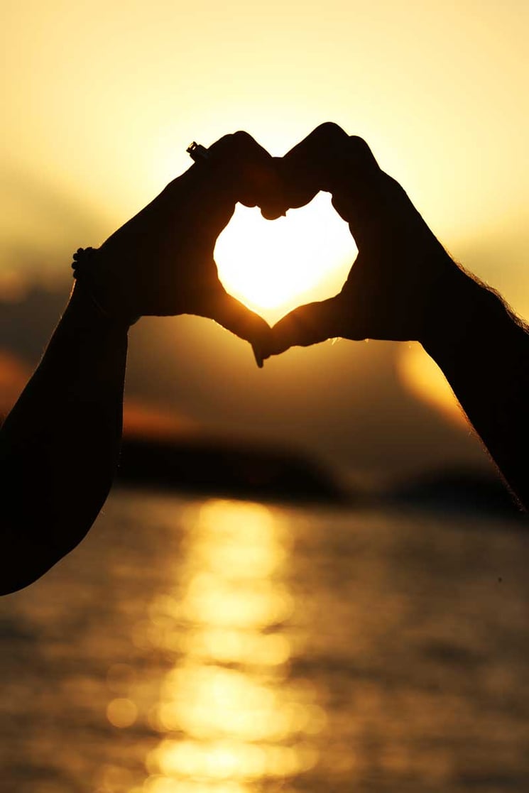 Heart hands sunset at Magic Island beach wedding Hawaii