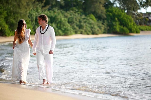 A couple getting married on a beach in Hawaii