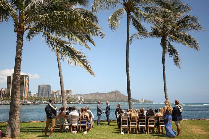 Grooms at a beautiful beach wedding at Magic Island with Diamond Head and Waikiki