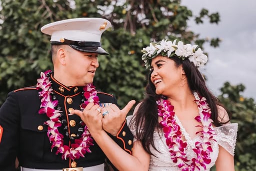 Military-wedding-couple-posing-with-Hawaiian-leis