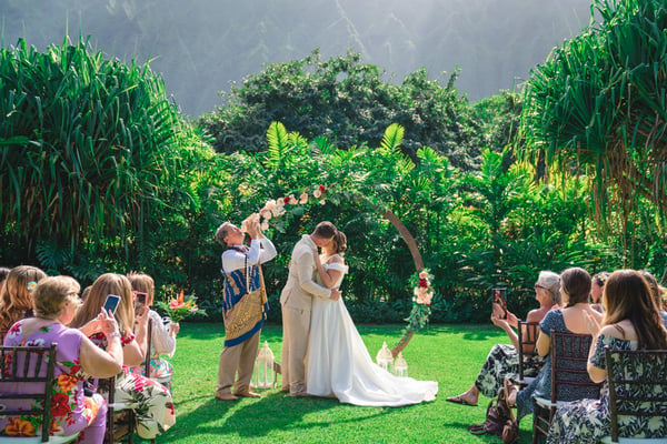 Hawaiian officiant blowing the conch shell