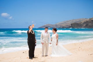 Officiant and couple at a Hawaii beach wedding