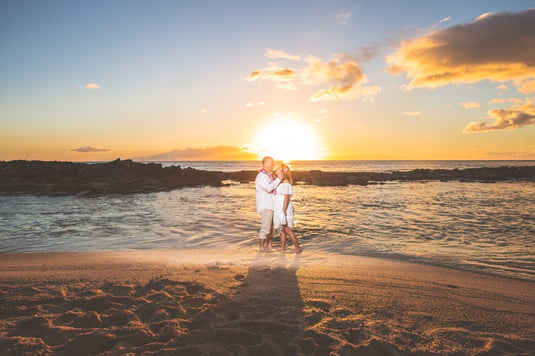 Couple at their sunset beach wedding in Hawaii