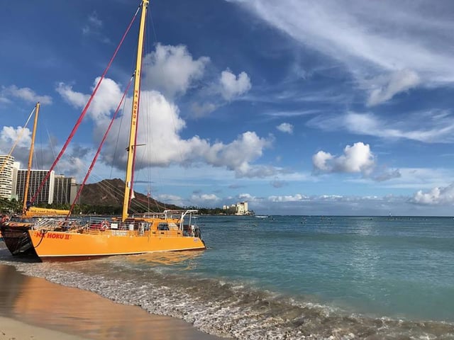 After getting married, a couple takes a catamaran cruise